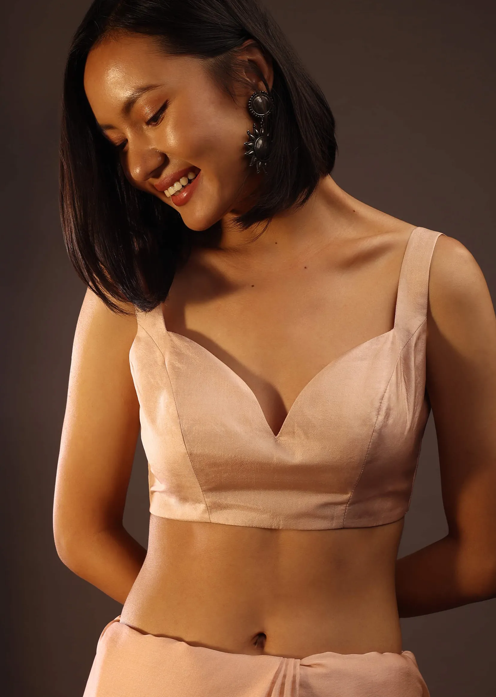 Peach Blush Sleeveless Blouse In A Sweetheart Neckline Back Hook Closure With A Straight Hemline
