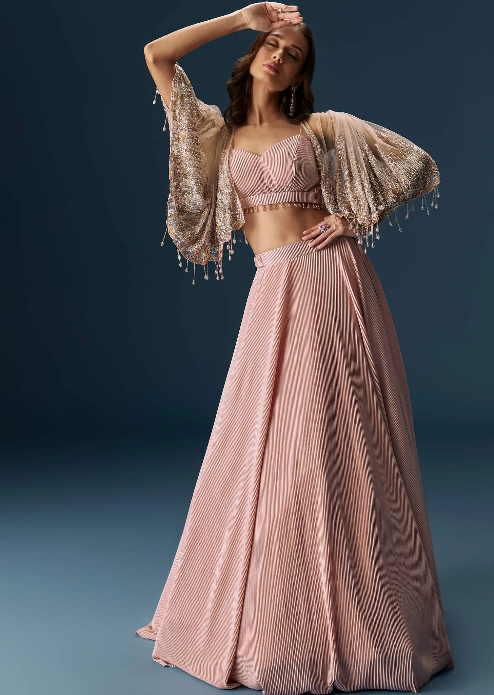 Peach Lehenga With Embroidered Blouse And Coordinating Cape