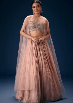 Peach Ruched Lehenga With Embroidered Blouse and Net Cape