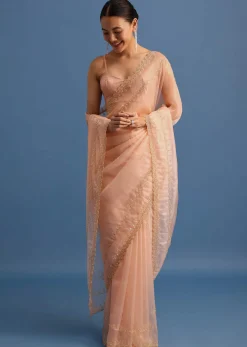 Peach Tissue Saree With Cutdana Embroidered Border And Unstitched Blouse