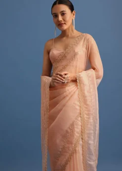 Peach Tissue Saree With Cutdana Embroidered Border And Unstitched Blouse
