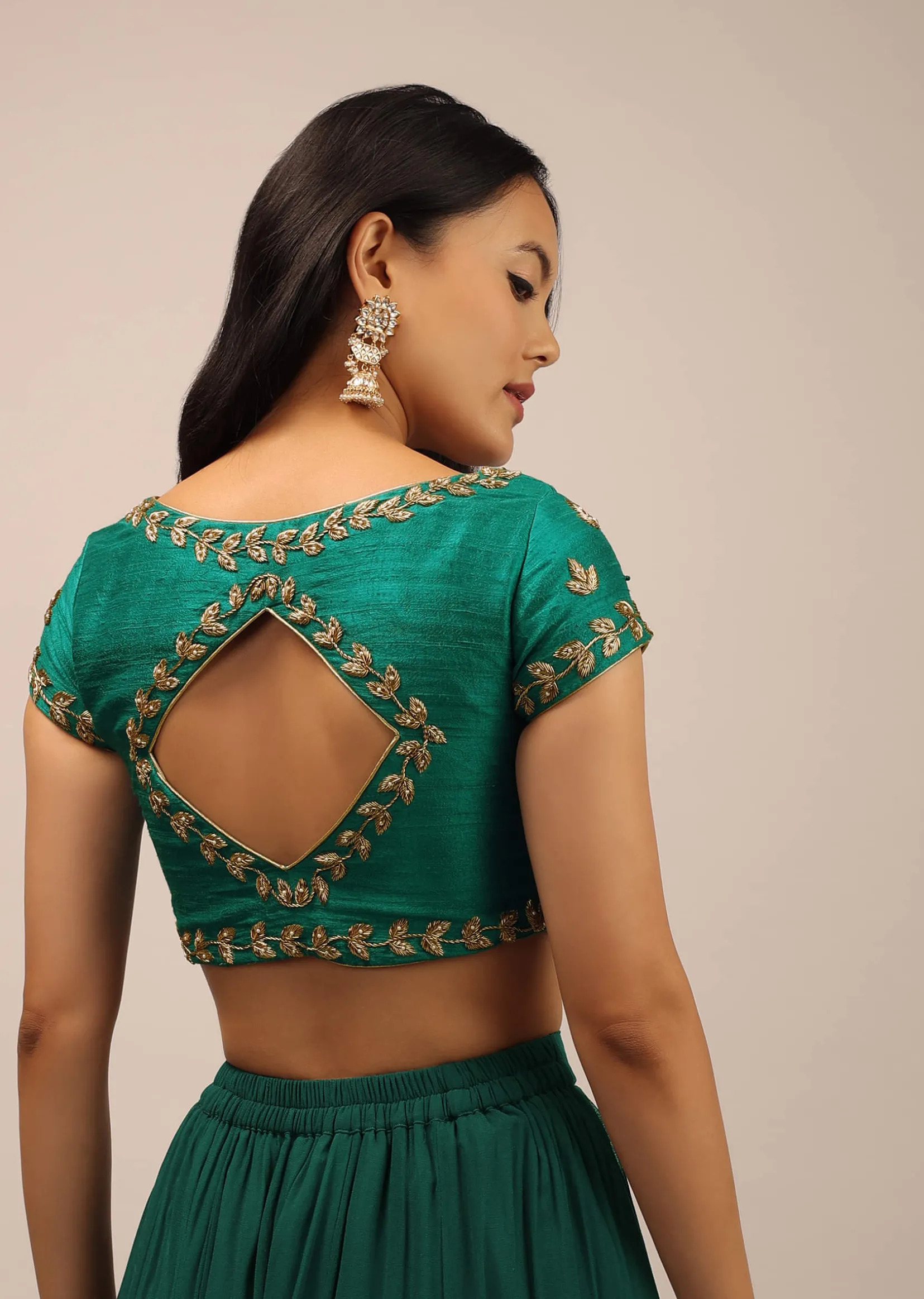 Peacock Green Blouse In Raw Silk With Zardosi Embroidery And A Diamond Cut Out On The Back
