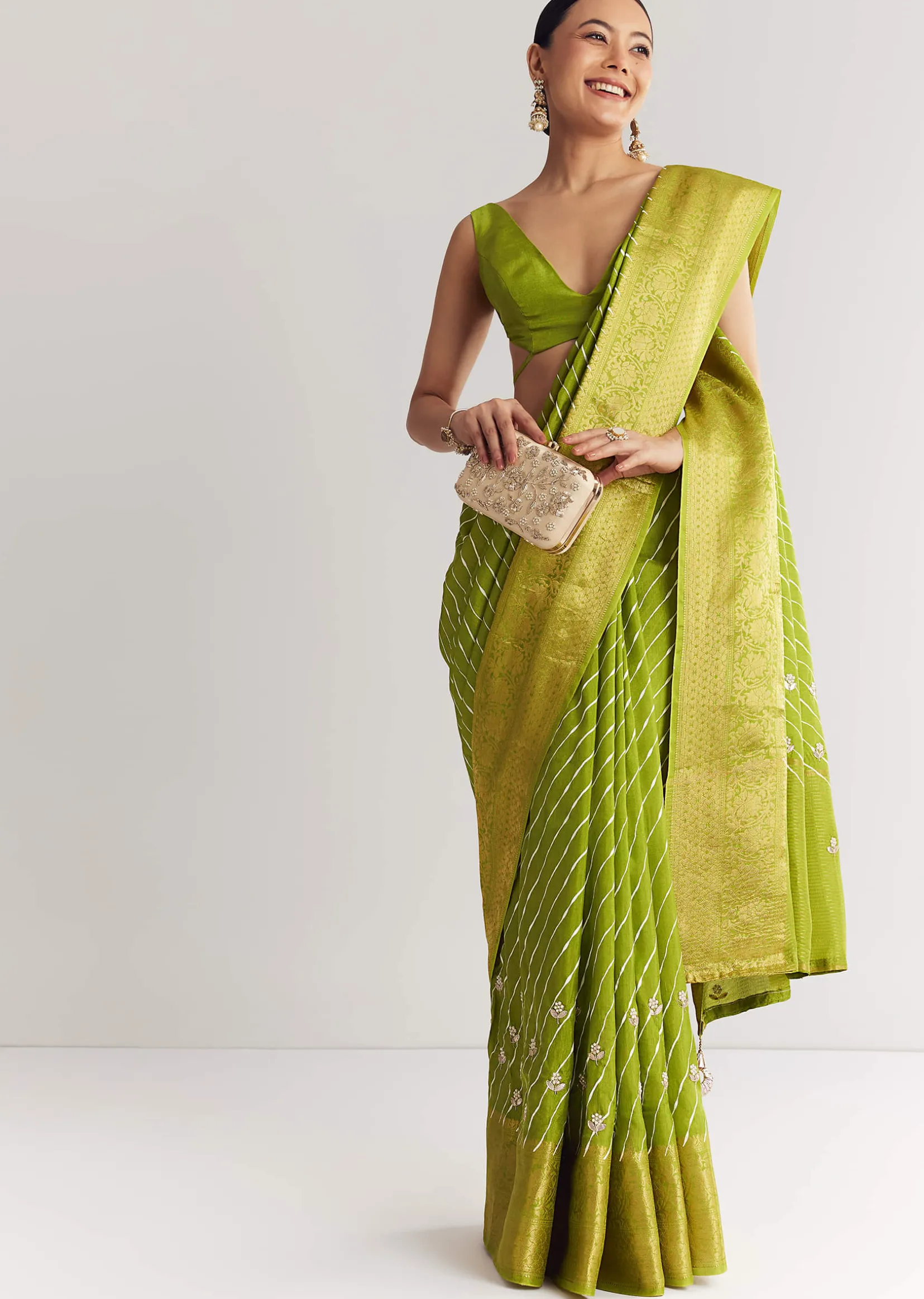 Pista Green Saree With Lehariya Print And Floral Gotapatti And Moti Work.