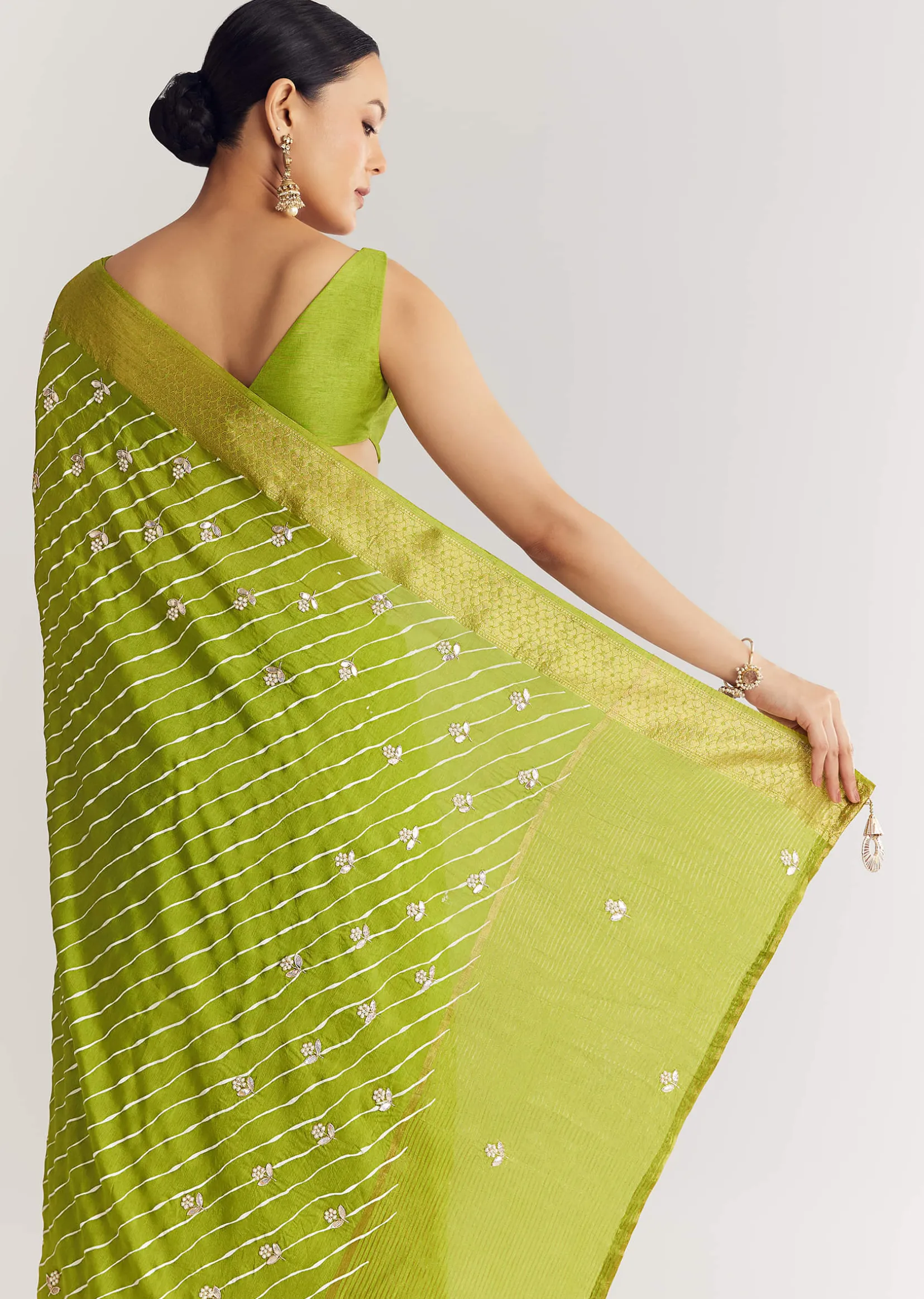 Pista Green Saree With Lehariya Print And Floral Gotapatti And Moti Work.