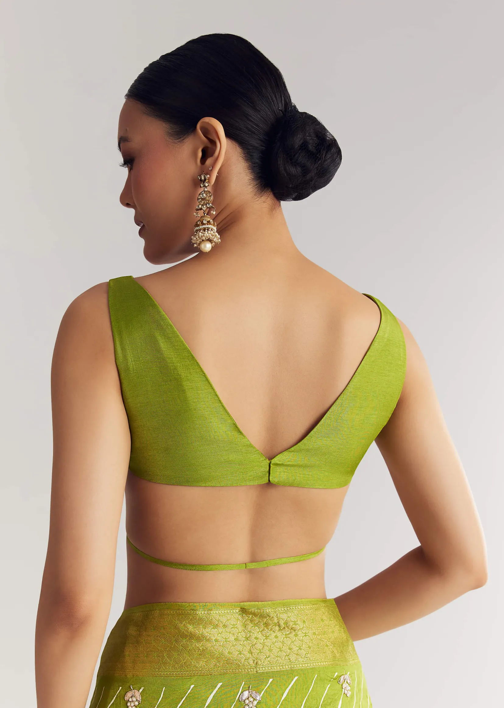 Pista Green Saree With Lehariya Print And Floral Gotapatti And Moti Work.