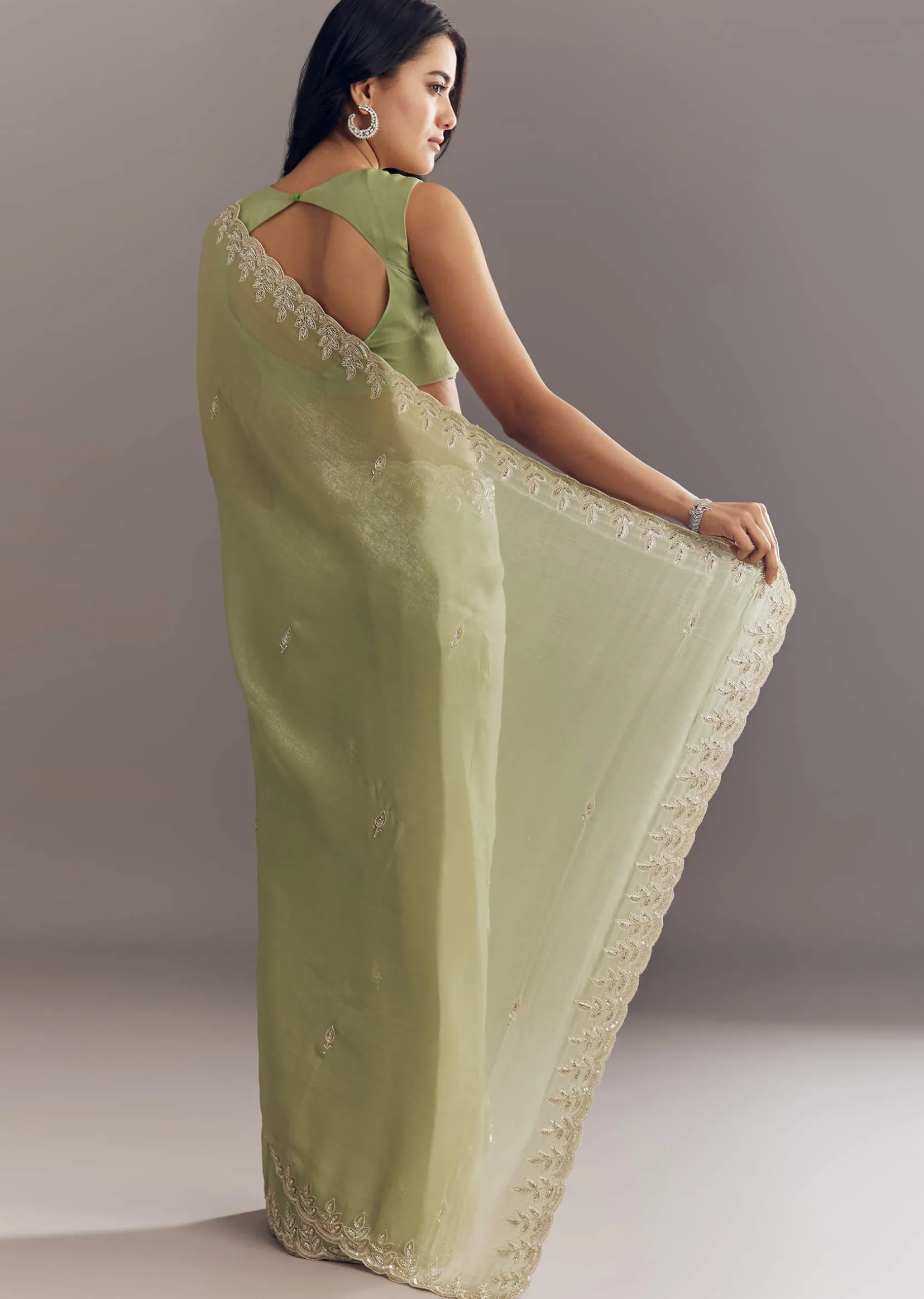 Pista Green Tissue Saree With Leaf Motif Embroidery In Sequins And Cutdana