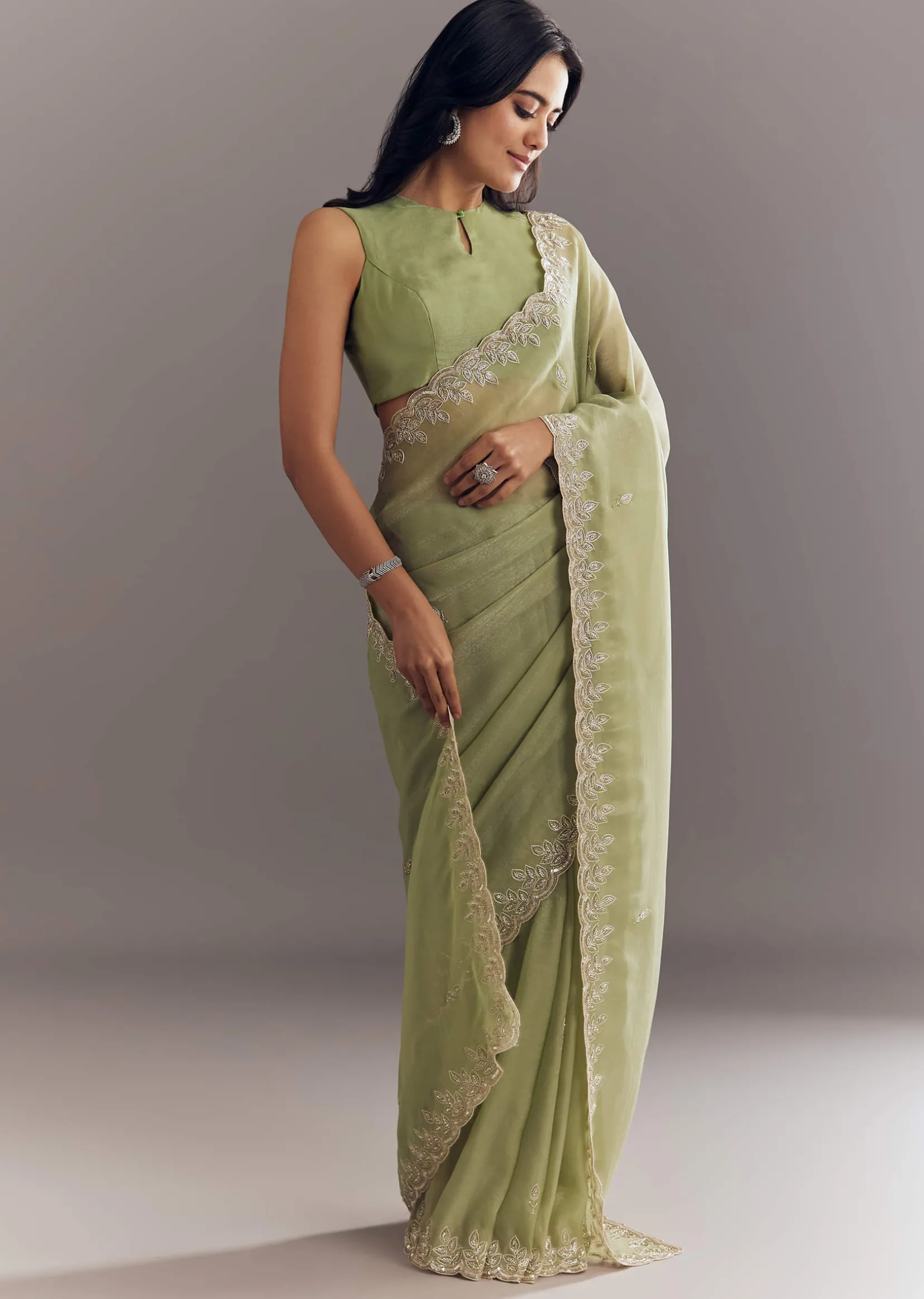 Pista Green Tissue Saree With Leaf Motif Embroidery In Sequins And Cutdana