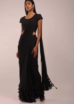 Pitch Black Saree With Three Tones Of Layered Frills On The Bottom Embellished In Stones And Sequins With A Tassel On The Pallu Corner