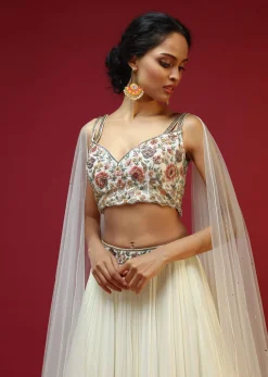 Powder White Lehenga Choli With Attached Cape And Hand Embroidery Using Colorful Resham And Sequins In Floral Motifs