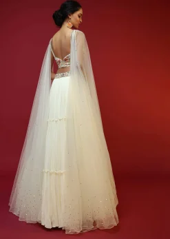 Powder White Lehenga Choli With Attached Cape And Hand Embroidery Using Colorful Resham And Sequins In Floral Motifs