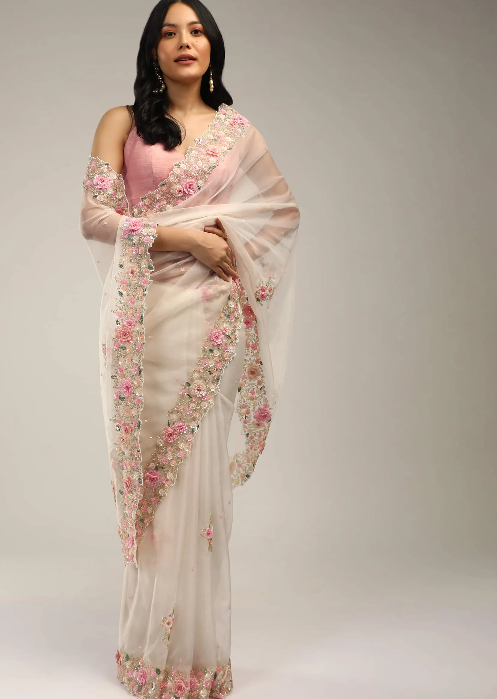 Powder White Saree In Organza With 3D Flower Embroidered Border And Buttis Featuring Multi Colored Moti And Sequins