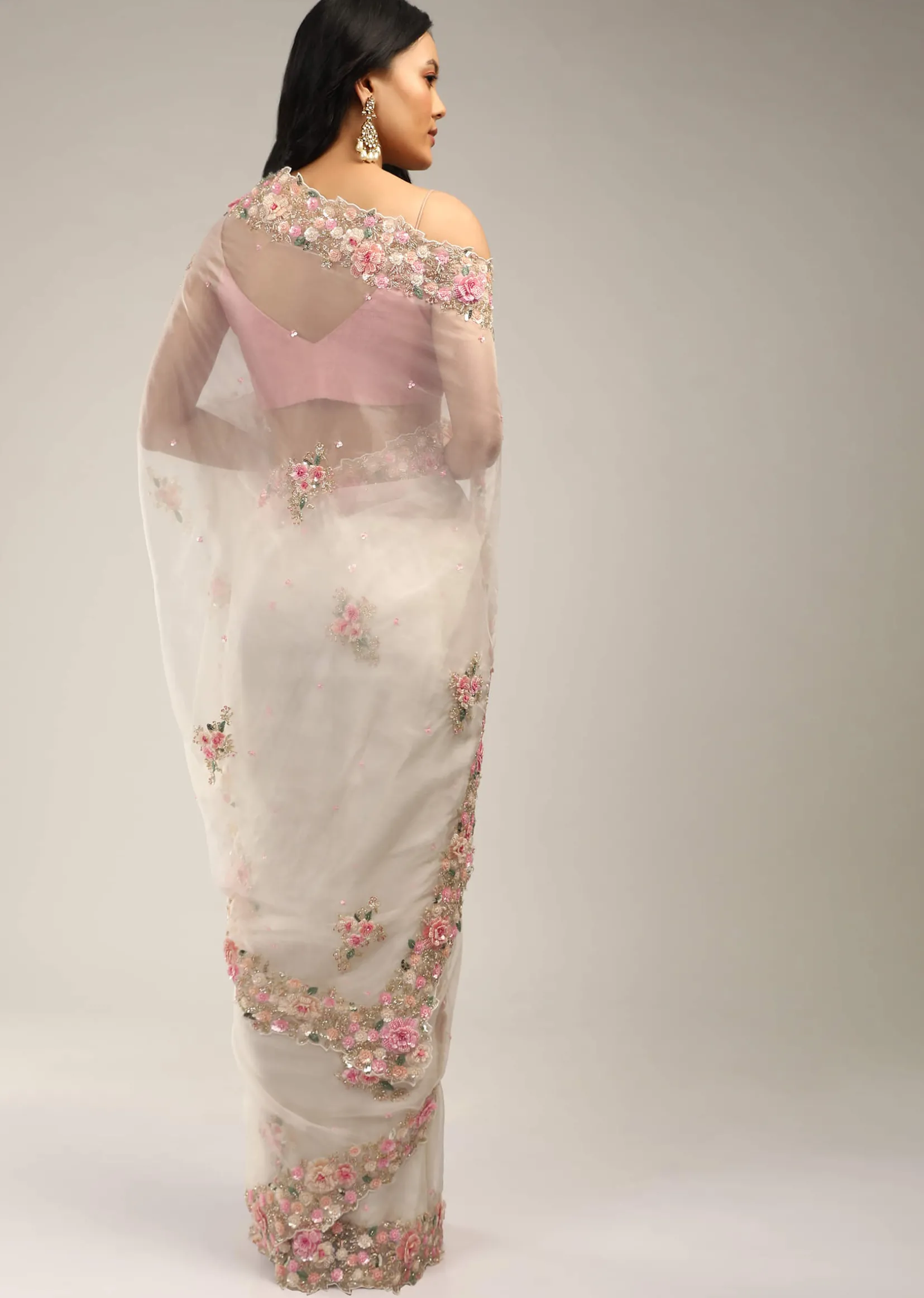 Powder White Saree In Organza With 3D Flower Embroidered Border And Buttis Featuring Multi Colored Moti And Sequins