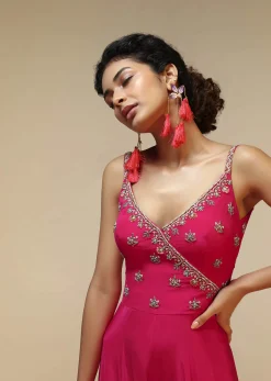 Rani Pink Jumpsuit With An Overlapping Neckline Adorned In Hand Embroidered Buttis Using Cut Dana And Sequins