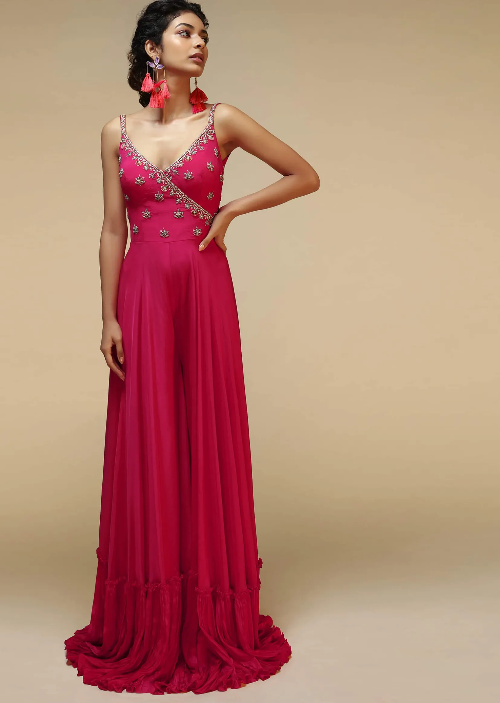 Rani Pink Jumpsuit With An Overlapping Neckline Adorned In Hand Embroidered Buttis Using Cut Dana And Sequins
