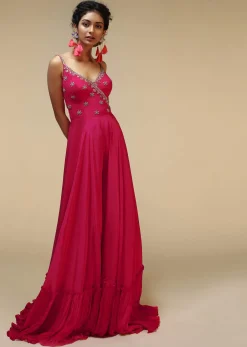 Rani Pink Jumpsuit With An Overlapping Neckline Adorned In Hand Embroidered Buttis Using Cut Dana And Sequins