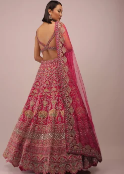 Rani Pink Lehenga In Golden Zari Work Embroidery Inspired By Mughal Architecture With Matching Net Dupatta In Embroidered Buttis