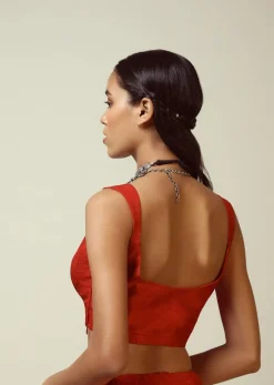 Red Sleeveless Blouse In Raw Silk With V Cut Neckline And Side Zip Closure