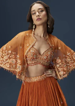 Rust Orange Embroidered Lehenga With Dramatic Cape And Blouse
