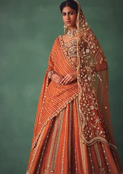 Rust Raw Silk Bridal Lehenga With Buti Work Dupatta