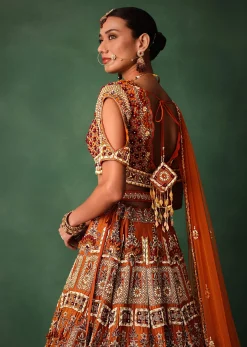 Rust Red Hand Work Bridal Lehenga With Deep Neckline Blouse And Dupatta