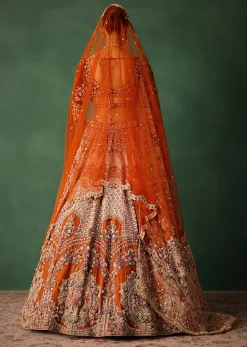 Rust V Neck Blouse With Heavy Jaal Cutdana Work Bridal Lehenga And Heavy Dupatta