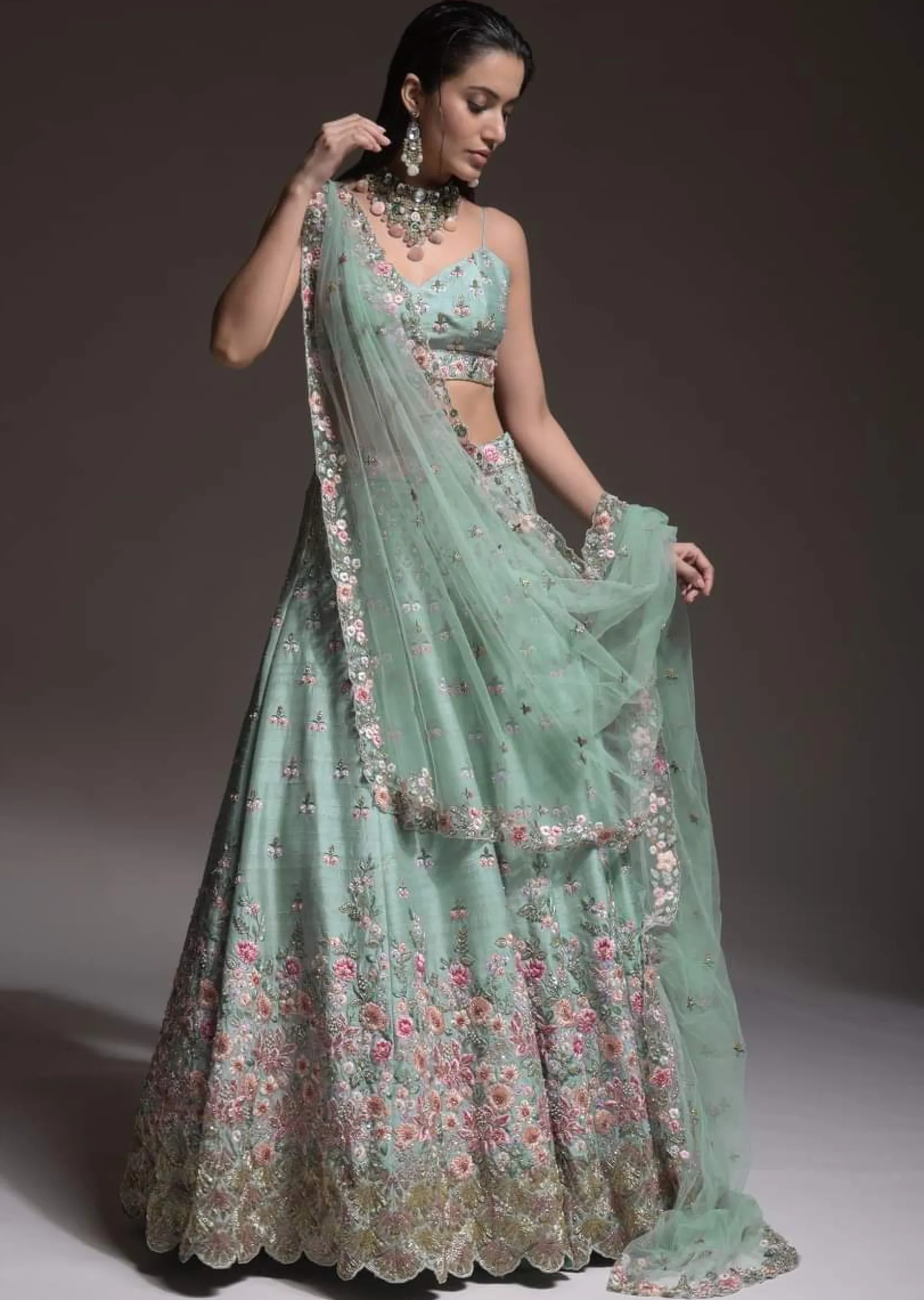Sage Green Lehenga Choli In Raw Silk With Vibrant Resham Embroidered Cluster Of Summer Blooms And Buttis