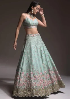 Sage Green Lehenga Choli In Raw Silk With Vibrant Resham Embroidered Cluster Of Summer Blooms And Buttis