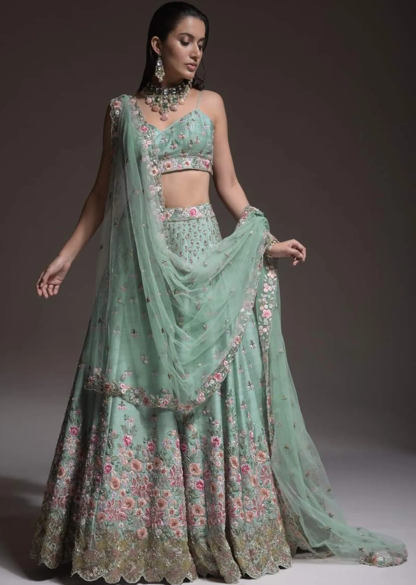 Sage Green Lehenga Choli In Raw Silk With Vibrant Resham Embroidered Cluster Of Summer Blooms And Buttis