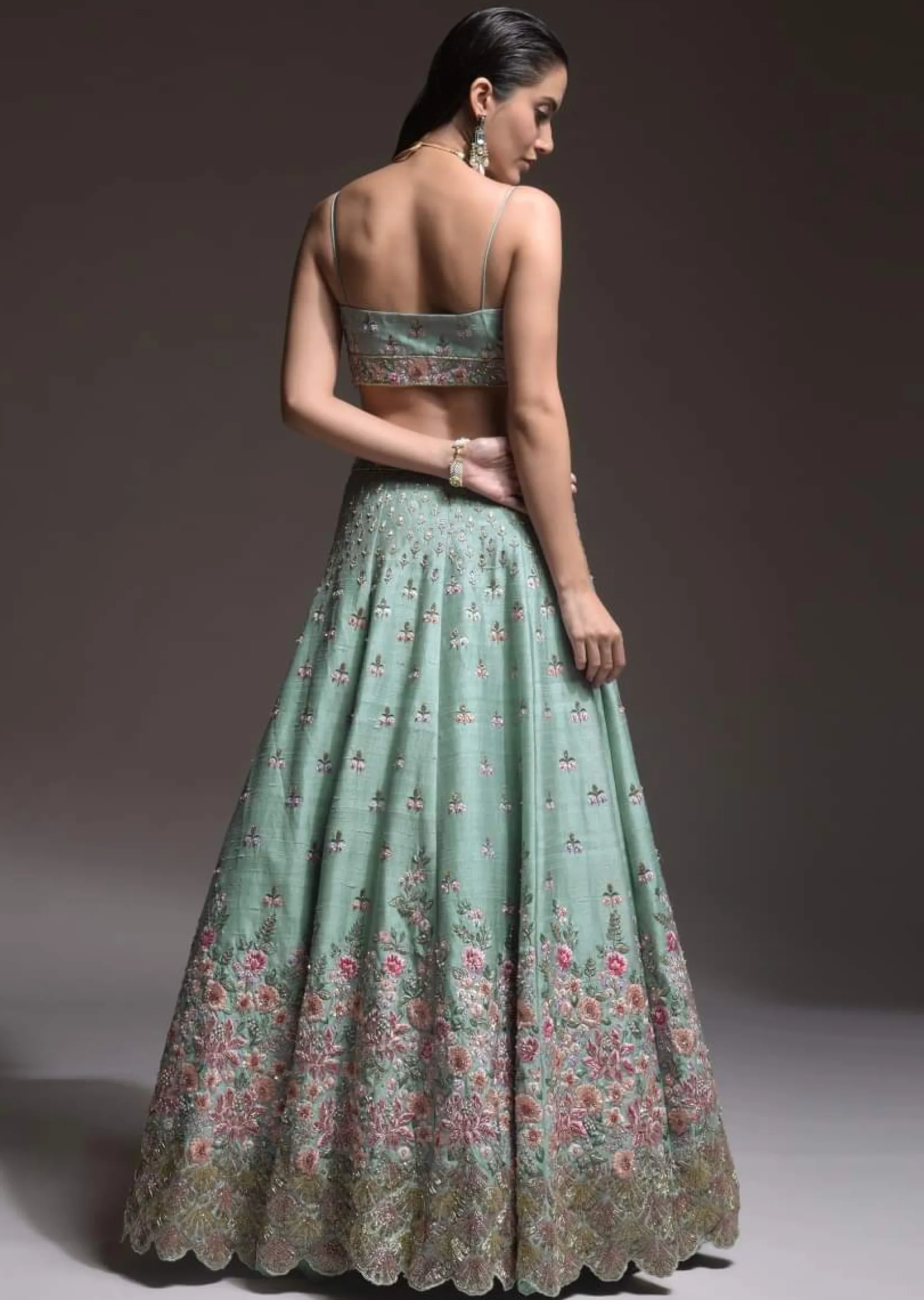 Sage Green Lehenga Choli In Raw Silk With Vibrant Resham Embroidered Cluster Of Summer Blooms And Buttis