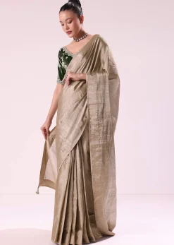 Silver Zari Tissue Saree With Embroidered Emerald Green Stitched Blouse