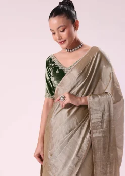 Silver Zari Tissue Saree With Embroidered Emerald Green Stitched Blouse