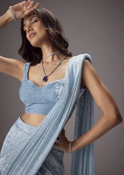 Sky Blue Shimmer Saree Paired With A Sweetheart Velvet Blouse