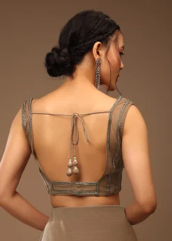 Taupe Grey Ready To Wear Saree With A Crop Top In Foil Applique Embellishment Sleeveless With A Tie-Up Tassel Dori At The Back.