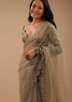 Tea Green Organza Saree With Self Buttis And A Floral Printed Satin Blouse