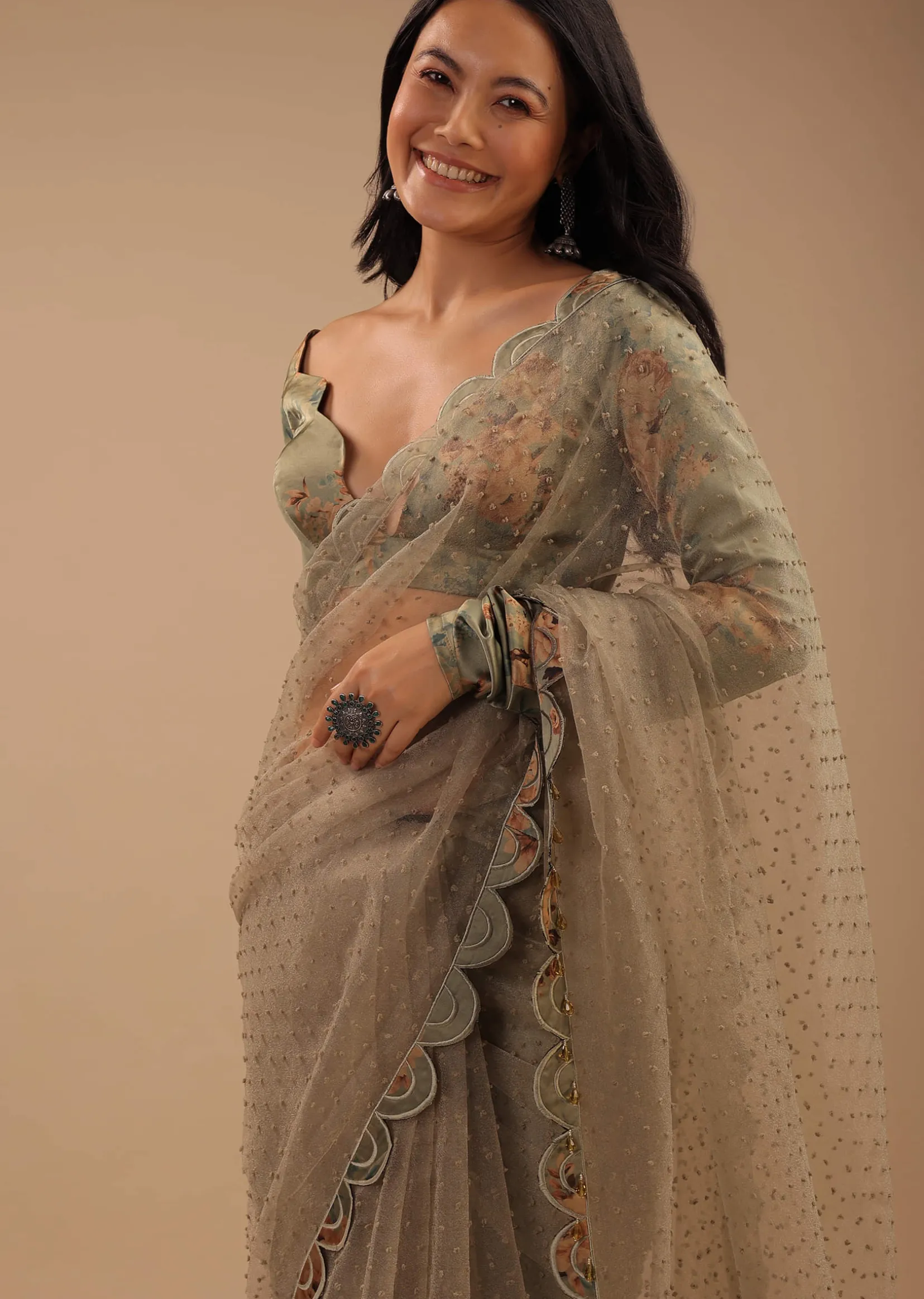 Tea Green Organza Saree With Self Buttis And A Floral Printed Satin Blouse