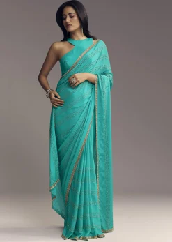 Turquoise Blue Embroidered Chinon Saree With Wavy Border