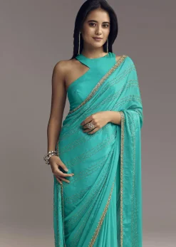 Turquoise Blue Embroidered Chinon Saree With Wavy Border