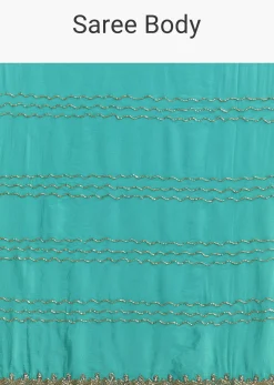 Turquoise Blue Embroidered Chinon Saree With Wavy Border
