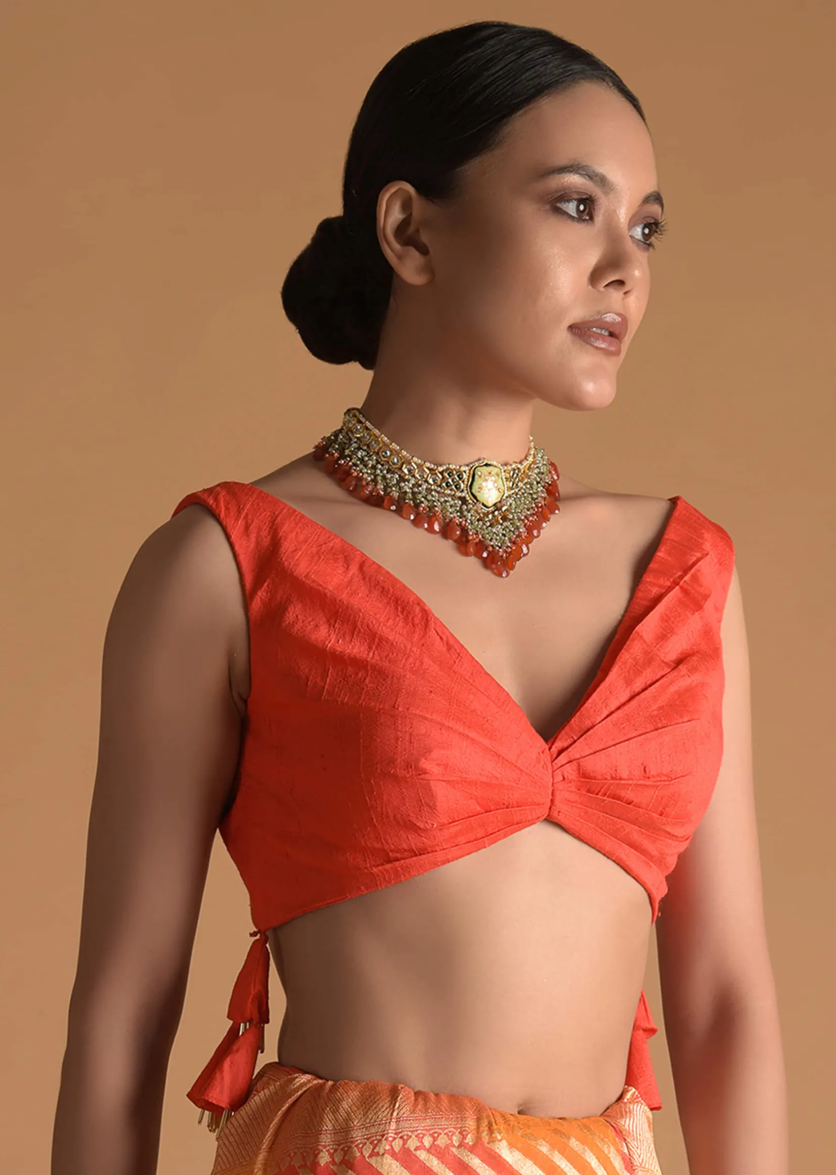 Vermillion Orange Blouse In Raw Silk With Pleat Details On The Front And Back Along With Tassels On The Sides