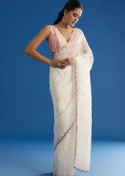 White Crepe Silk Saree With Mirror Scallop Border And Pink Contrast Blouse