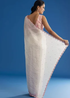 White Crepe Silk Saree With Mirror Scallop Border And Pink Contrast Blouse