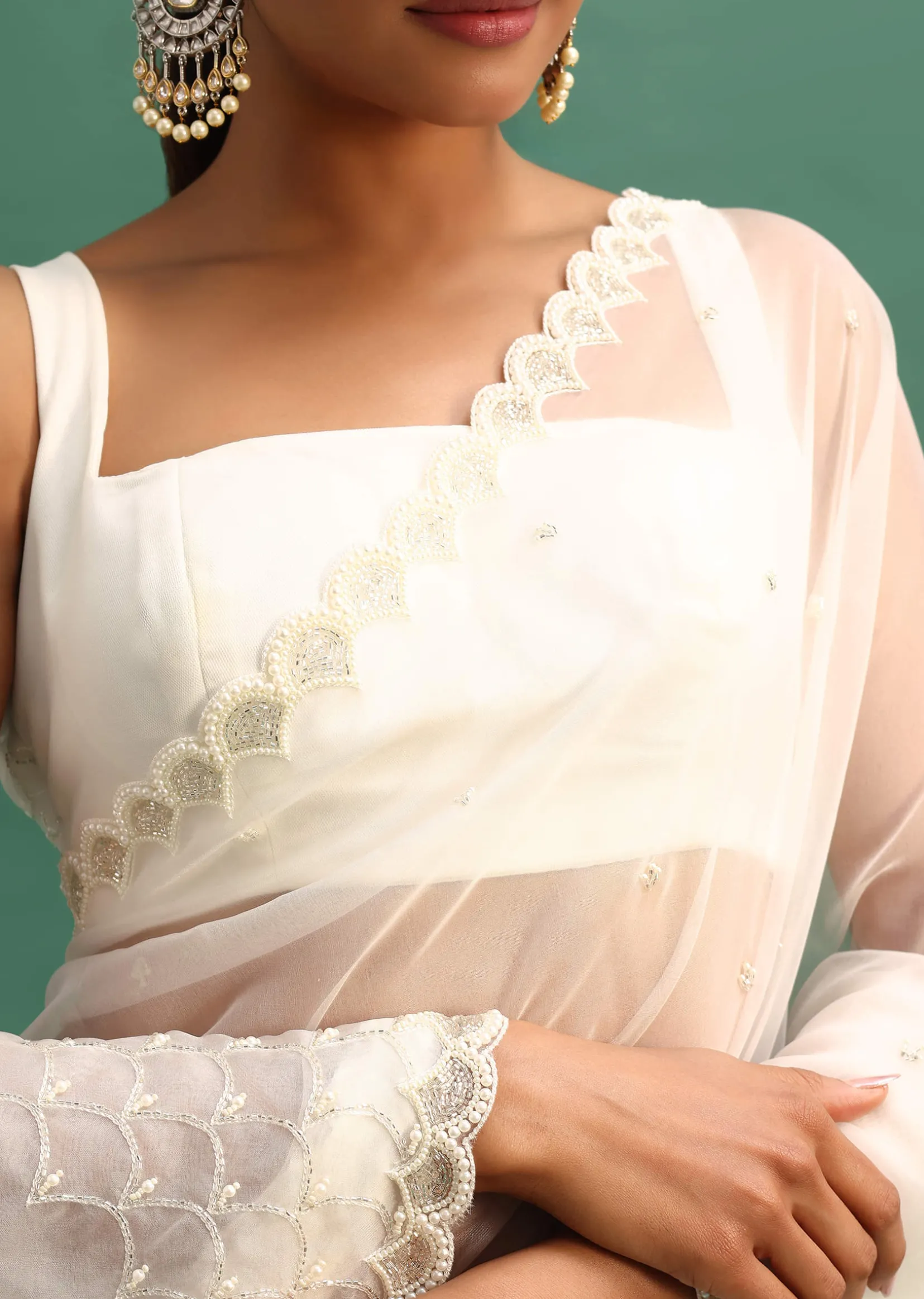 White Organza Saree With Beads And Cutdana Embroidery And Unstitched Blouse
