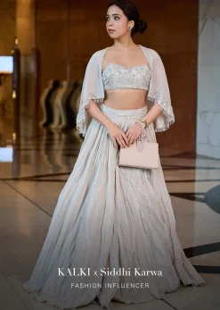White Ruched Lehenga With Spaghetti Blouse And Cape
