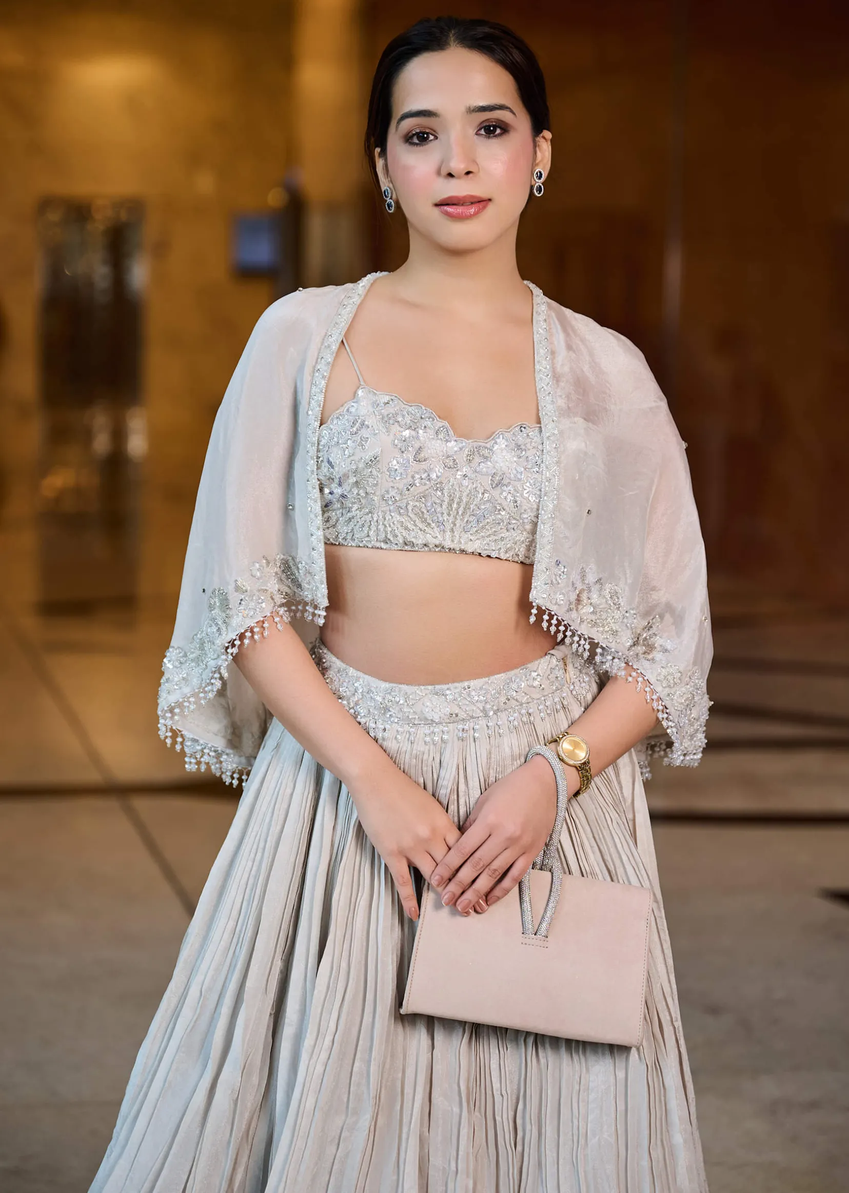 White Ruched Lehenga With Spaghetti Blouse And Cape