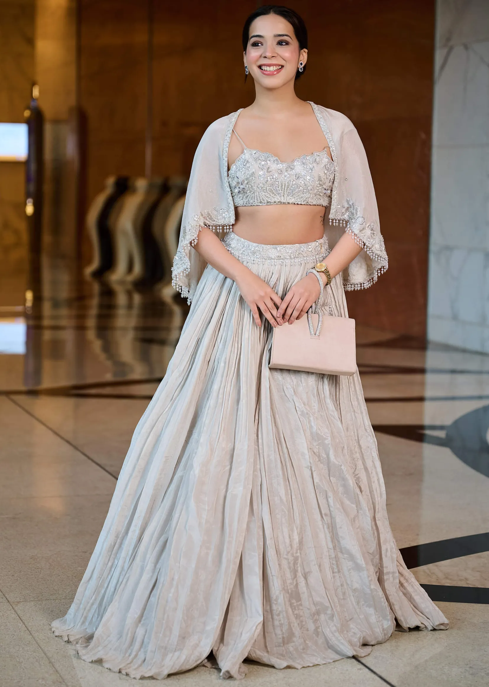White Ruched Lehenga With Spaghetti Blouse And Cape