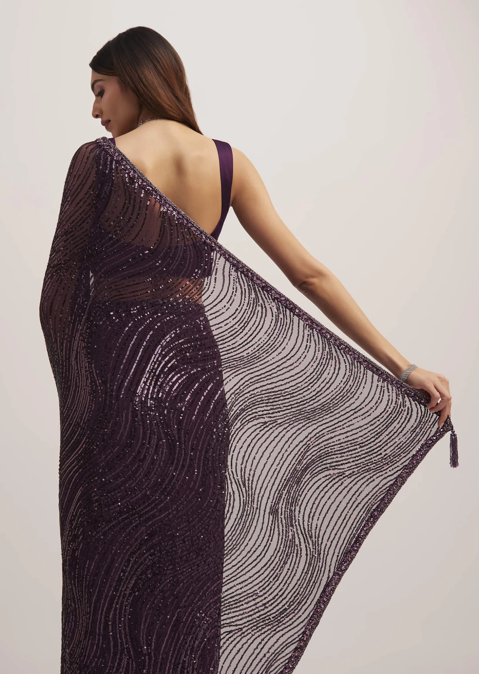 Wine Purple Sequins Saree With An Embellished Border