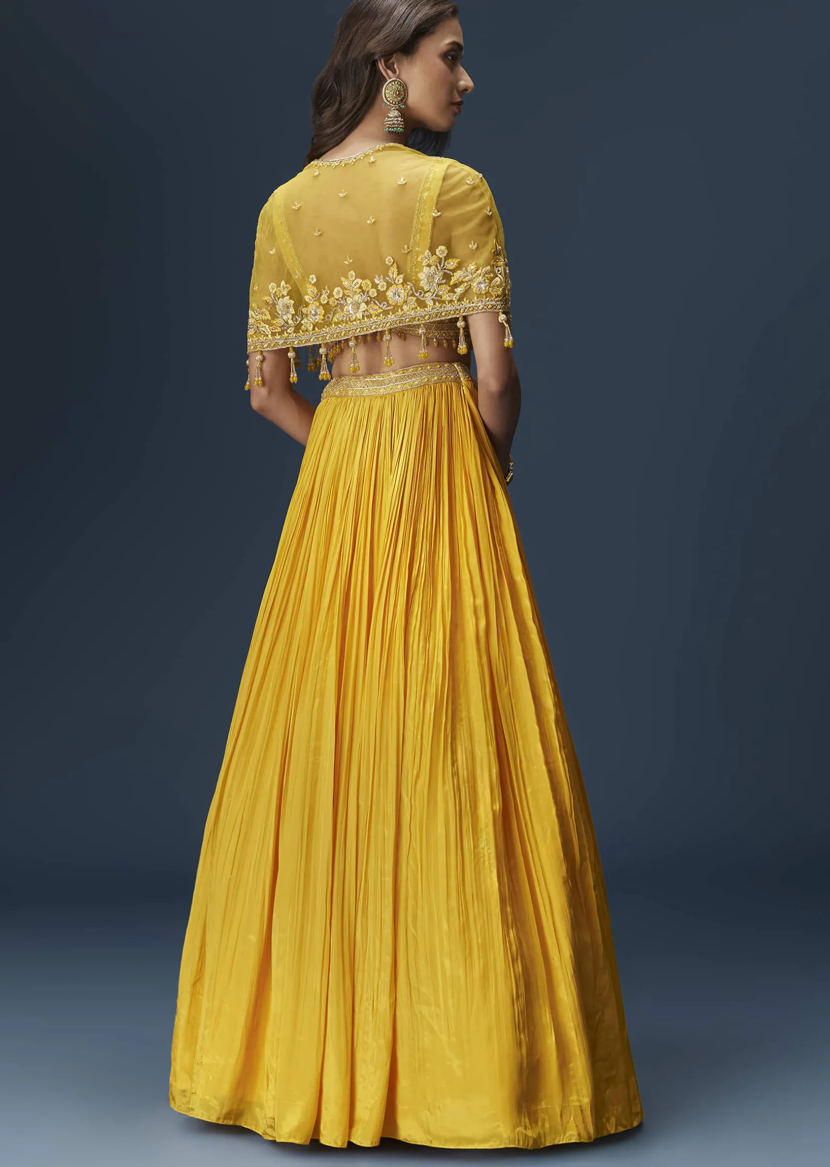 Yellow Bridesmaid Lehenga With Sleeveless Blouse And Draped Cape